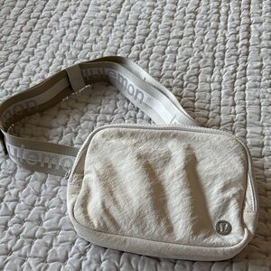 Lululemon Cream Crossbody Bag with watermark strap